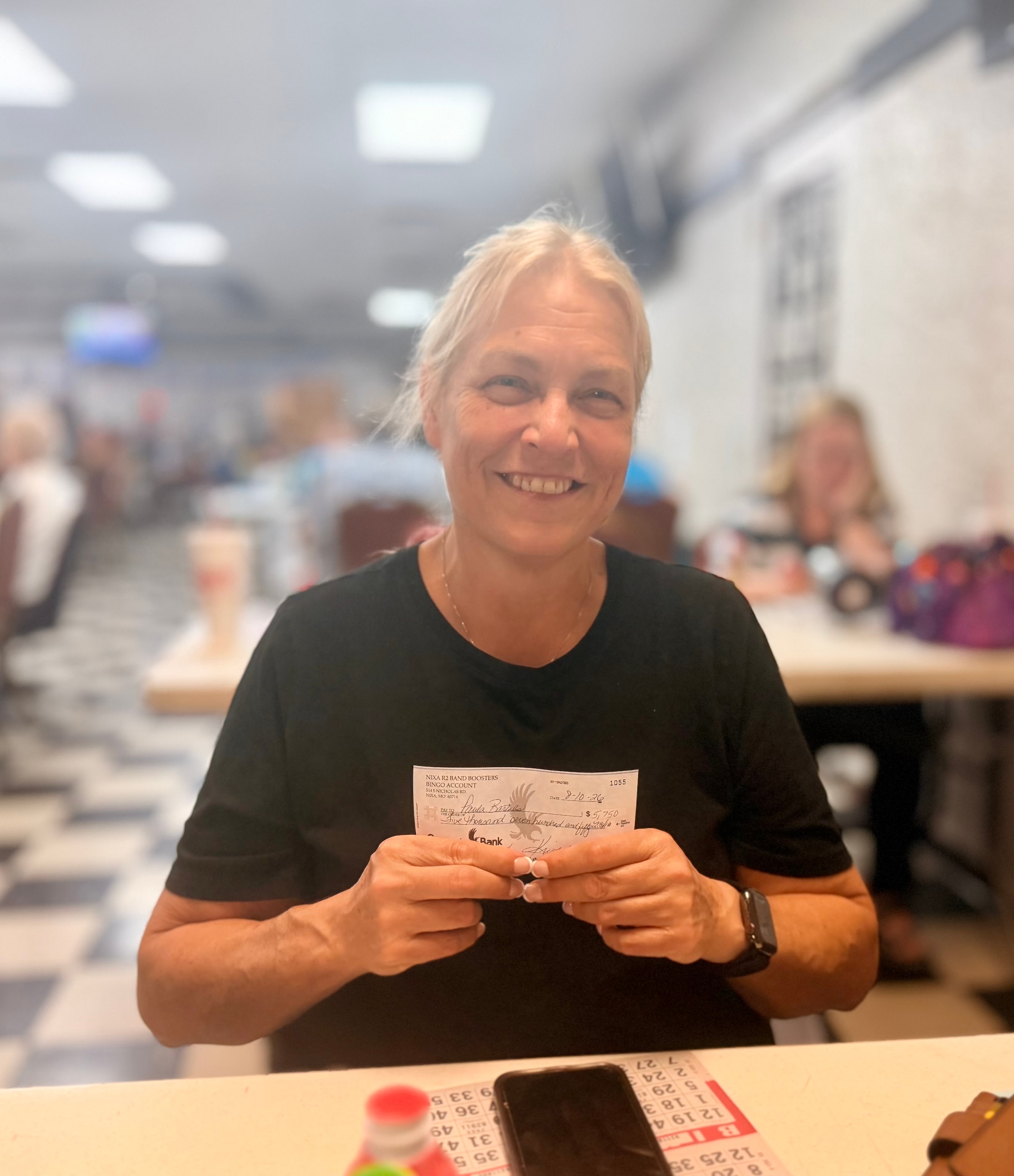 Bingo winner holding winning check